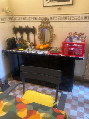 a counter with a mirror and a chair in a room at Appartement dans le Vieux-Nice in Nice