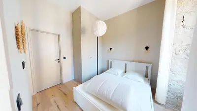 a bedroom with a white bed and a mirror at ApartHotel Riviera - BALCON BARLA - Old Port PLace du Pin in Nice