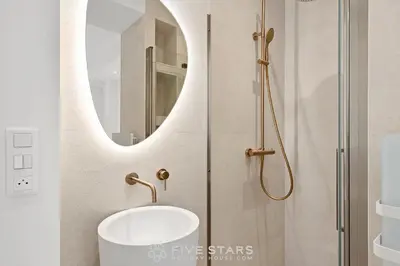 a bathroom with a sink and a shower at Suite Grand Sud FSHH in Nice
