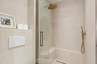 a shower with a glass door in a bathroom at Suite Grand Sud FSHH in Nice