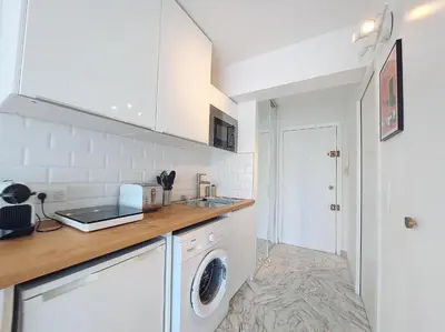 a kitchen with a washer and dryer on a counter at Nestor&Jeeves - LIFESTYLE - Terrace - Modern in Nice