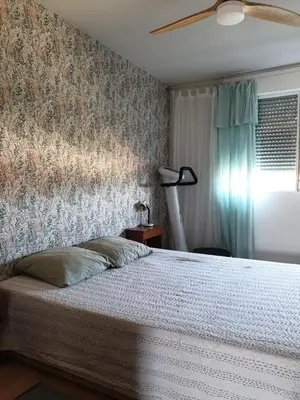 a bedroom with a bed and a ceiling fan at Bel appartement lumineux T3 Terrasse in Nice