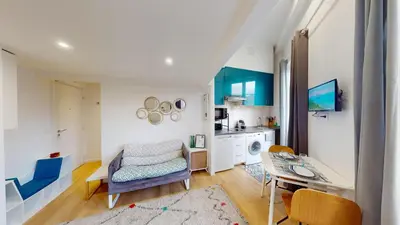 a living room with a ladder and a chair at Joli studio centre-ville Nice proche de la gare in Nice