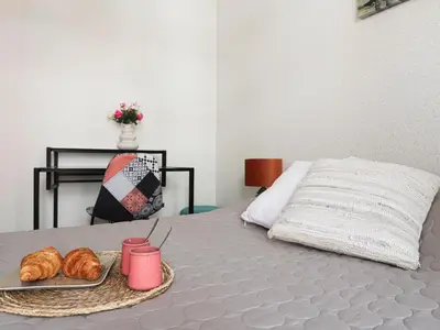 a tray of croissants and a tray of bread on a bed at Apartment Les Balcons de Battisti by Interhome in Nice