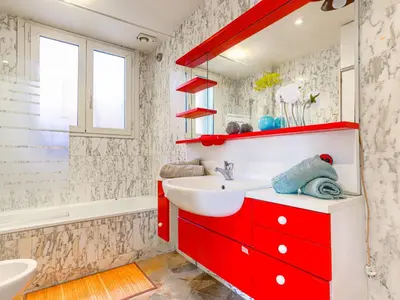 a bathroom with a red cabinet and a sink at Apartment Le Palais Foch by Interhome in Villefranche-sur-Mer