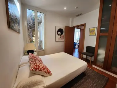a bedroom with a bed with two pillows on it at Villa Bethanie in Villefranche-sur-Mer