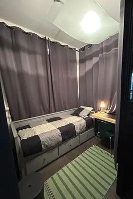 a room with a bed in a tent with a desk at Villa Nice in Nice