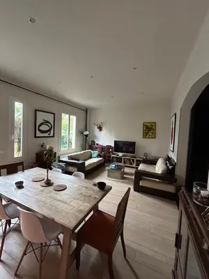 a large living room with a table and chairs at Villa Nice in Nice