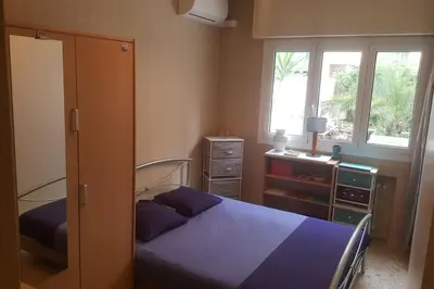 a bedroom with a bed and a dresser and a window at F4 6 Couchages Terrasse Proche Centre in Nice
