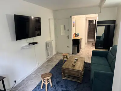 a living room with a couch and a table at Studio à Nice - 10 min de la plage in Nice