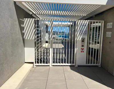 an entrance to a building with an open gate at Panoramic Sea View Appartment Blue Pearl in Nice