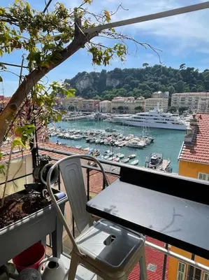 a balcony with a view of a harbor with boats at Dernier étage port de Nice in Nice