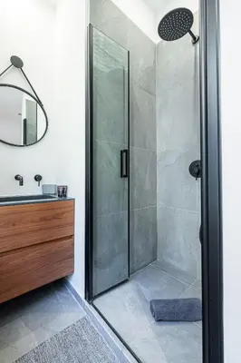 a shower with a glass door in a bathroom at FEEL HOME - VISTA Di PORTU in Nice