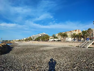 a shadow of a person standing on the beach at Appartement 3 PIECES NICE Promenade in Nice