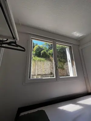a bedroom with a window in a room at Nice appartement for 2 adults with air-conditioning in Nice
