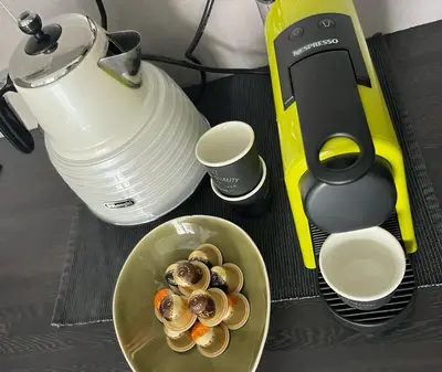 a table with a blender and a bowl of food at Perfectly located holiday place in Beaulieu-sur-Mer