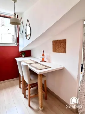 a dining room with a white table and chairs at Little Nest - Old Town - Breakfast - Wifi - AC in Nice