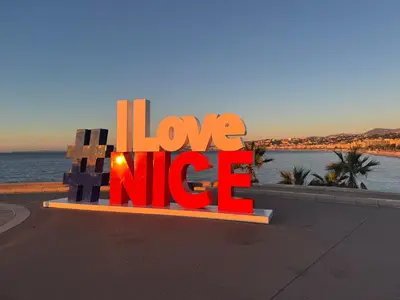 a sign that says love nike on the side of a road at Studio palais des arts in Nice