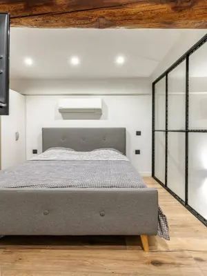 a bedroom with a large bed in a room at Cocon au cœur du Vieux Nice in Nice