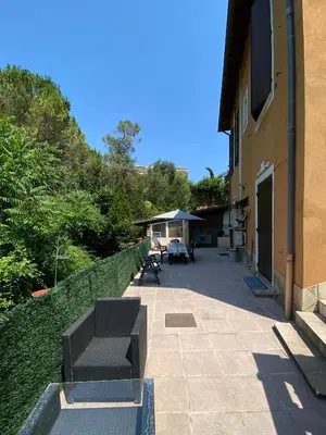 a bench sitting on a patio next to a building at Villa Serenice - F2 au calme, climatisé, WIFI et parking gratuit in Nice