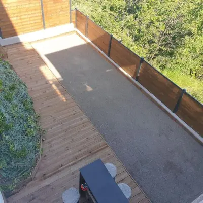 a wooden deck with a bench on top of it at VILLA MODERNE PISCINE JACUZZi in Nice