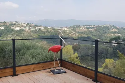 a flamingo statue sitting on top of a balcony at VILLA MODERNE PISCINE JACUZZi in Nice
