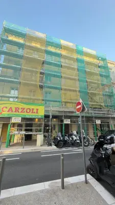 a building under construction with motorcycles parked in front of it at #13 Orange suite AC Wifi Balcony 3mins walk sea front in Nice