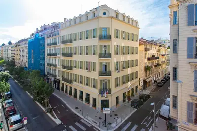 a tall yellow building on a city street at #13 Orange suite AC Wifi Balcony 3mins walk sea front in Nice