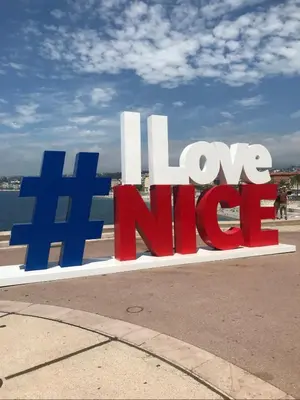 a sign that says i love nida on a street at République in Nice