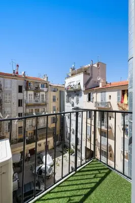 a balcony with a view of a city with buildings at Magnifique 3 pièces de 80m2 dans le Carré d'Or in Nice