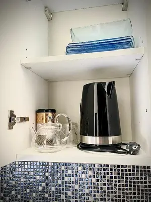 a coffee maker on a shelf in a kitchen at Malyandco in Nice
