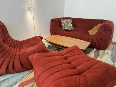 a living room with two couches and a coffee table at Cosy Sea Front Garden Nice in Nice