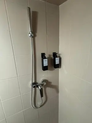 a shower in a bathroom with a shower head at Duplex proche port de Nice in Nice
