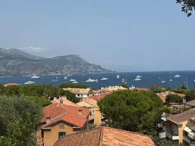 a view of a town with boats in the water at Magnifique villa pieds dans l eau Saint Jean Cap Ferrat in Saint-Jean-Cap-Ferrat
