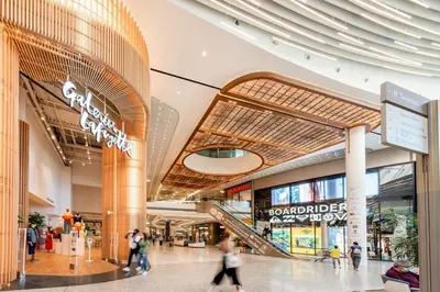 a shopping mall with people walking through it at Azur & Chill - à proximité Mer Train Bus Aéroport in Saint-Laurent-du-Var