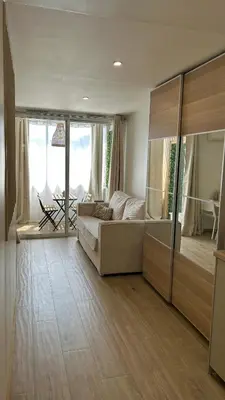 a living room with a couch and a large window at Azur & Chill - à proximité Mer Train Bus Aéroport in Saint-Laurent-du-Var