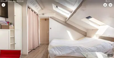 a bedroom with a bed in a room with a ceiling at Studio atypique central mais calme, quartier VIP, plage 50m in Nice