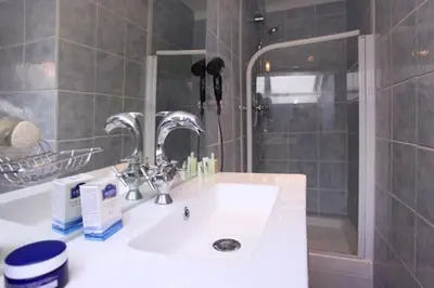 a bathroom with a sink and a shower at Studio atypique central mais calme, quartier VIP, plage 50m in Nice