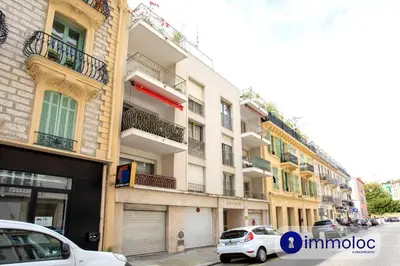 a white car parked in front of a building at Studio Air-conditioned district of the Musicians in Nice