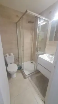 a bathroom with a shower and a toilet and a sink at Petit studio promenade des Anglais in Nice
