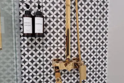 a purse and two bottles of wine on a wall at Rêves d'Orient - proche mer in Nice