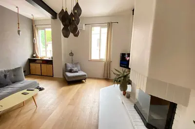 a living room with a couch and a fireplace at 06BX Loft Pessicart in Nice
