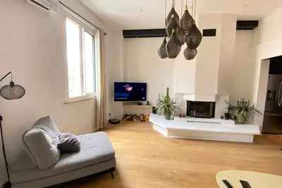 a living room with a couch and a tv at 06BX Loft Pessicart in Nice