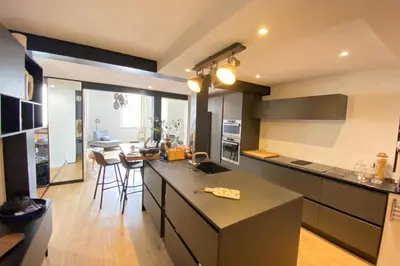 a kitchen with a counter and a dining room at 06BX Loft Pessicart in Nice