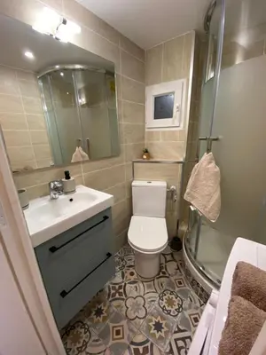 a bathroom with a toilet and a sink and a shower at Studio Hérold - Évasion avec Terrasse à Nice in Nice