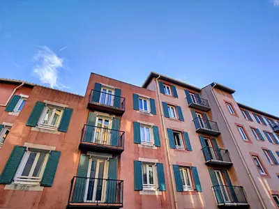 a tall building with windows on the side of it at Nestor&Jeeves - PLACE DU PIN - Near Port - Old town in Nice