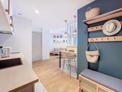 a kitchen with a blue wall and a table at Nestor&Jeeves - PLACE DU PIN - Near Port - Old town in Nice