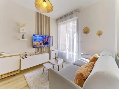 a white living room with a couch and a tv at City Center - Magnificent Apartment - Cozy - Wifi in Nice