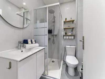 a white bathroom with a shower and a toilet at City Center - Magnificent Apartment - Cozy - Wifi in Nice