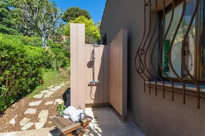 a door to a building with a bench next to it at VILLA LA PETITE RESERVE VI4416 By Riviera Holiday in Èze